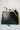 Different items such as digital camera, makeup, products all tucked inside the Ava pouch in Midnight Black Leather by esnner